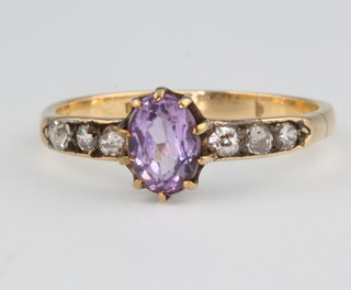 An 18ct yellow gold amethyst and diamond ring size Q