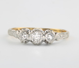 An 18ct yellow gold 3 stone diamond ring size P 