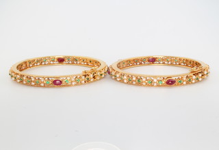 A yellow gold jade ring size L and 2 paste set gilt bangles 