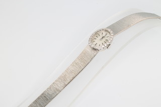 Rolex, a lady's 14ct white gold diamond set wristwatch on a ditto bracelet