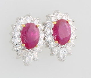 A pair of 18ct white gold ruby and diamond ear studs, the rubies approx. 2.46ct, the diamonds approx 1.27ct 