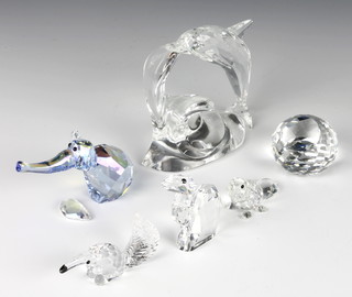 A Swarovski Crystal figure of an ant eater 2", do. camel 1 1/2", a beaver 1", a spherical paperweight, an elephant and dolphin