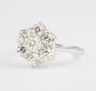 An 18ct white gold 7 stone diamond cluster ring approx. 1.5ct size M