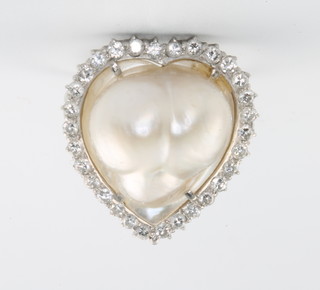 A white gold baroque pearl and diamond ring surrounded by brilliant cut diamonds, size J 