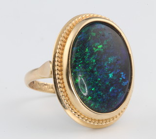 A 14ct yellow gold black opal set ring size N 