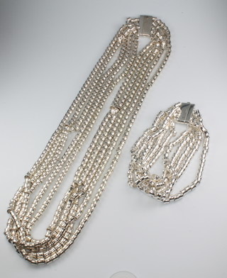 A stylish silver multi strand necklace and bracelet 237 grams 
