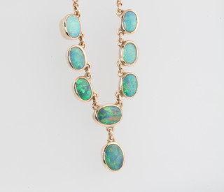A 9ct yellow gold black opal necklace