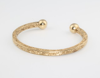A 9ct chased gold torque bracelet 39.5 grams 