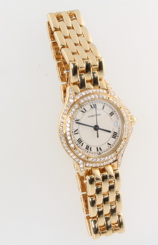 Cartier, a lady's 18ct yellow gold and diamond set Cartier Panthere Cougar quartz wristwatch with calendar dial and sapphire glass, the bezel surrounded by brilliant cut diamonds with a diamond set winder, No. 887907/001598  
