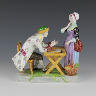 A German porcelain group of a gentleman at a table with lady in attendance 7" 