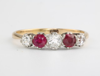 An 18ct yellow gold ruby and diamond 5 stone ring size O 1/2 