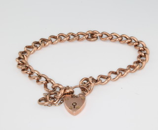 A 9ct yellow gold hollow link bracelet with heart padlock 9 grams 
