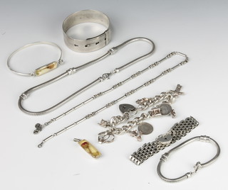 A silver bangle and minor silver jewellery 157 grams