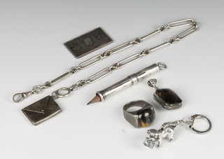 A silver envelope stamp case and minor silver jewellery, 108 grams 