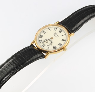 A gilt cased Longines quartz wristwatch with seconds at 6 o'clock on a leather strap 