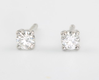 A pair of 18ct white gold and diamond ear studs approx 0.15ct each 