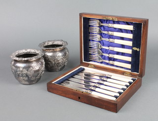 A cased set of 6 plated fish eaters in an oak canteen and a pair of plated repousse pots 4" 
