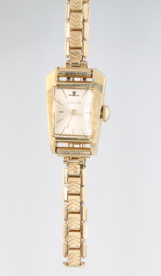 A lady's 14ct gold Le Coultre stylish wristwatch on a gilt bracelet 