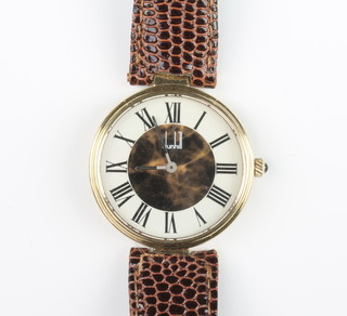 A gentleman's silver gilt Dunhill wristwatch on a leather strap 