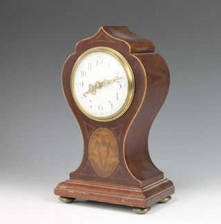 An Edwardian timepiece with enamelled dial and Arabic numerals contained in an inlaid mahogany balloon shaped case 