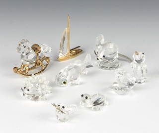 A set of 4 Swarovski Crystal miniature figures of a rocking horse, hedgehog, mouse and fish and a crystal yacht, tortoise, mouse, penguin and clam shell 