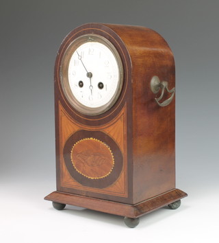 An Edwardian striking mantel clock with enamelled dial and Arabic numerals contained in an arch shaped inlaid mahogany case 
