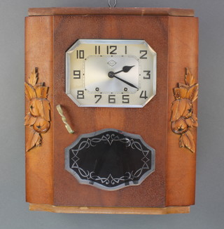 MAP, a French Art Deco 8 day striking wall clock with diamond shaped silvered dial contained in a mahogany case 
