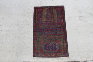 A brown and red ground Balochi prayer rug decorated a temple 57" x 39" 