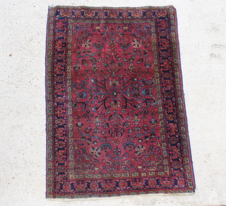 A red and blue ground Persian Sarough rug 58" x 40" 