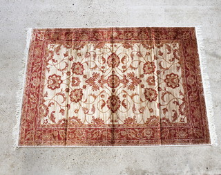 A gold ground and floral patterned Belgian cotton "Ziegler" rug 75" x 52 1/2"  