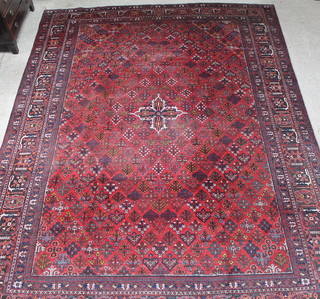 A red and blue ground Persian Josheghan carpet 174" x 132", some wear