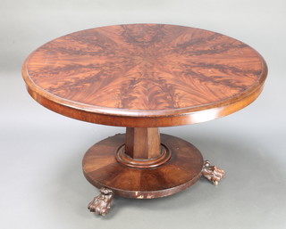 A Victorian circular snap top flame mahogany breakfast table, raised on a chamfered column with circular base and paw feet 27"h x 47" diam. 