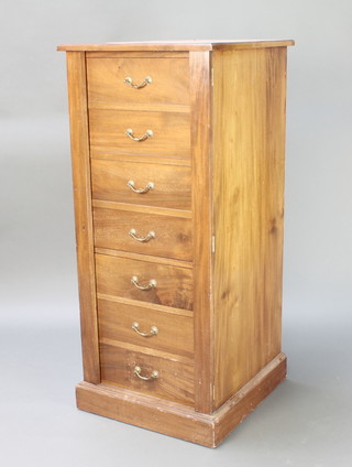 A Victorian walnut safe cabinet in the form of a Wellington chest, the upper section fitted a cupboard enclosed by 4 faux drawers above 3 drawers, raised on a platform base 51"h x 22"w x 24"d