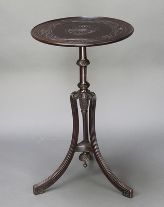 An Edwardian Georgian style circular carved mahogany wine table raised on a pillar and tripod supports 28" x 17" diam. 