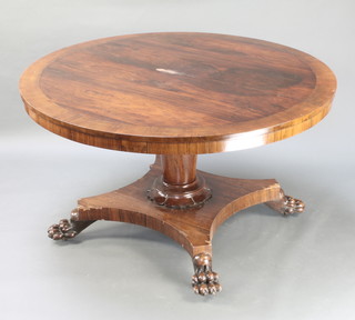 A William IV circular rosewood and crossbanded breakfast table, raised on a turned column and triform base with paw feet 29"h x 51 1/2" diam. (with 2 bolts)