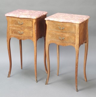 A pair of French inlaid Kingwood bedside cabinets of serpentine outline and with pink veined marble tops, fitted 2 drawers raised on cabriole supports with gilt metal mounts 29"h x 15"w x 12"d 