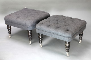 A pair of Victorian style stools upholstered in grey buttoned material, raised on turned ebonised supports with silvered caps and casters 18"h x 27"w x 27"d 