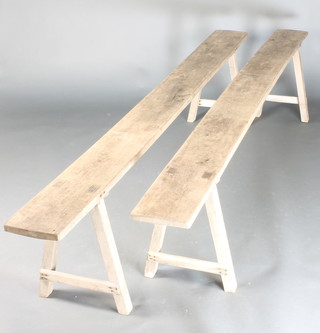 A pair of weathered trestle benches 21"h x 101"l x 9"w 