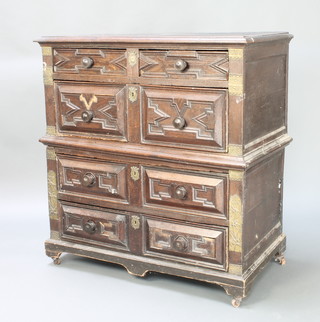 A Jacobean oak chest with geometric mouldings fitted 2 short and 3 long drawers with gilt metal mounts and in 2 sections, raised on bracket feet 43"h x 41"w  x 22"d 