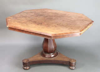 A Victorian elongated octagonal snap top breakfast table raised on a bulbous turned column and triform base with bun feet 27"h x 49"w x 39"d