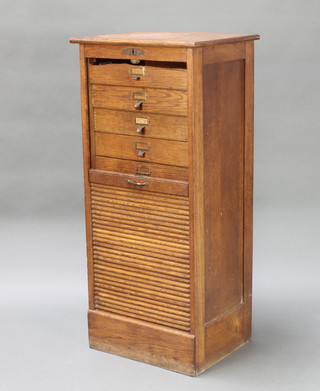 A Victorian light oak filing chest of 10 drawers enclosed by a tambour shutter, complete with key 42" x 19" x 15"