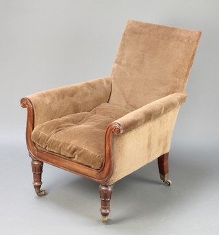 A William IV mahogany show frame armchair upholstered in brown corduroy material raised on turned and fluted supports, brass caps and casters 