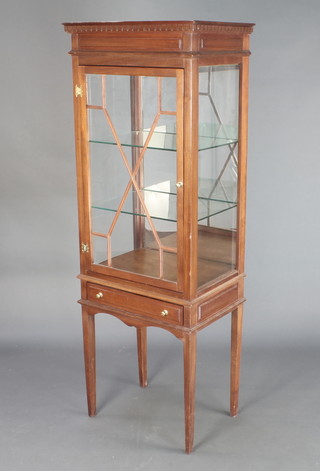 A Georgian style mahogany display cabinet with moulded and dentil cornice, interior fitted shelves enclosed by astragal glazed panelled door, the base fitted 1 long drawer and raised on square tapering supports 60"h x 21"w x 15"d 