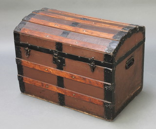 A Victorian arched wooden and metal bound trunk with metal drop handles 20"h x 28"w x 18"d 