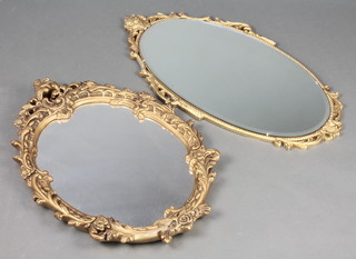 2 oval plate mirrors contained in decorative gilt frames 10" x 25" x 17 1/2" 