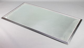 A rectangular bevelled plate mirror contained in a black and silver frame 69 1/2" x 38" 