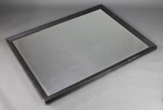 A rectangular bevelled plate wall mirror contained in an ebonised frame 51" x 39" 