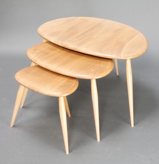 A nest of 3 Ercol interfitting "Pebble" occasional tables bases dated 1980