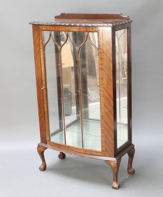 A Chippendale style mahogany display cabinet, the interior with mirrored back and shelves enclosed by astragal glazed doors, raised on cabriole supports 49"h x 27 1/2"w x 14"d 