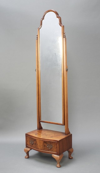 A Queen Ann style cheval mirror contained in a shaped walnut frame the serpentined base fitted a drawer, raised on cabriole supports  64"h x 17" x 12" 
 